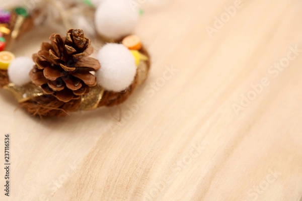 Obraz 松ぼっくりのついたクリスマスリースの背景素材２