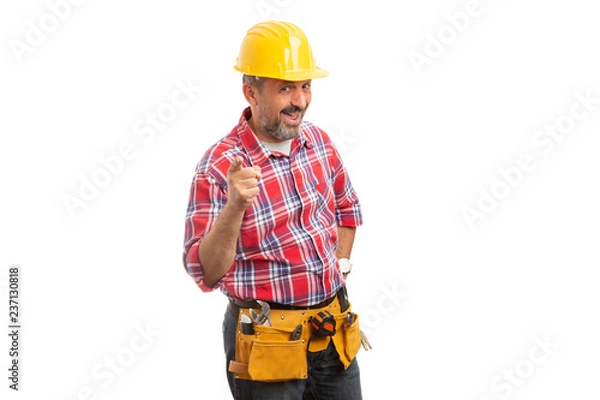 Fototapeta Constructor holding finger as joking concept.