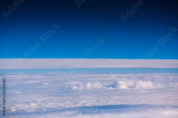 Fototapeta Flying above the clouds. view from the airplane