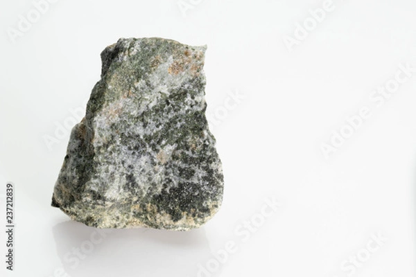 Fototapeta The pyroxenes are a group of important rock-forming inosilicate minerals stone, from Vesuvius volcano, isolated on a white background, Naples, Italy