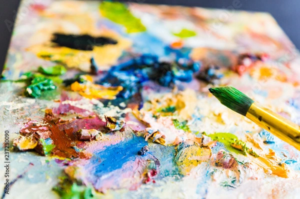 Fototapeta Art brush and palette with oil paints. Soft focus