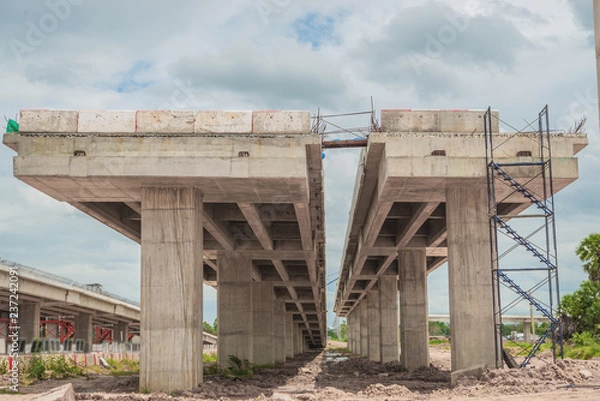 Fototapeta Parallel bridge way under contruction,countryside,long bridge,tollway,The road outside,Site construction of the bridge tollway large.