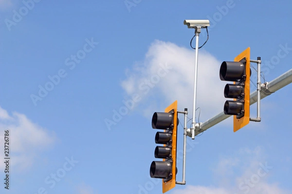 Obraz Secure camera with traffic light and sign.