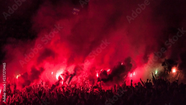 Obraz Football fans lit up the lights, flares and smoke bombs