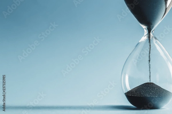 Obraz Hourglass on blue background