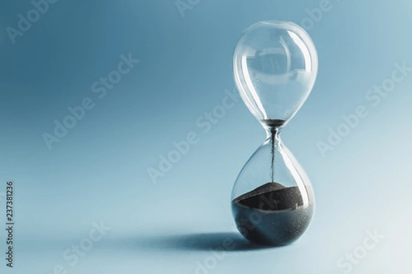 Obraz Hourglass on blue background