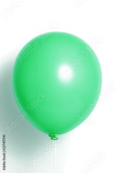 Fototapeta Green balloon on white background with shadow. Side glare.