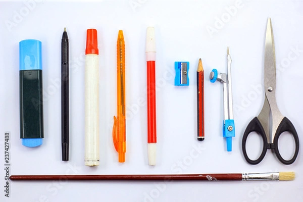 Fototapeta top view school stuff on white