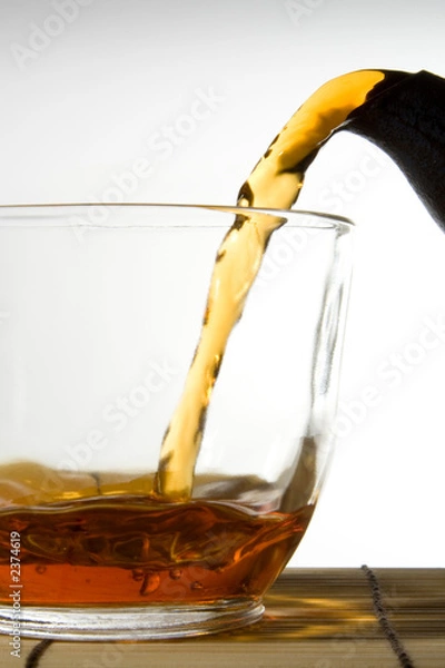 Obraz tea pouring into glass cup
