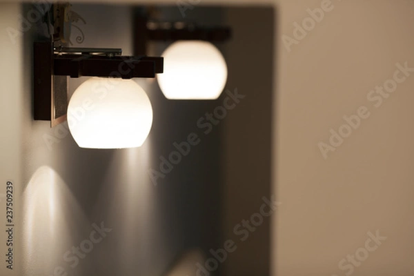 Obraz Wall lamps with white shade.