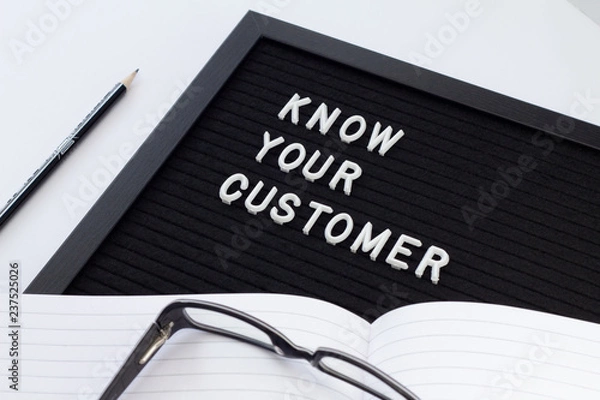 Fototapeta Know Your Customer - business concept, white text message on black board. Idea of business identification and finance safety. Cyber crime.