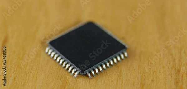 Fototapeta Electronic components: microchip macro image, focused in first pin