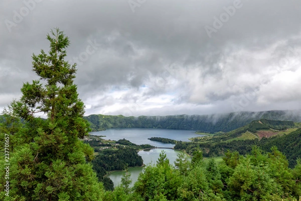 Fototapeta Clouds moving quickly through the Sete Cidades caldera.