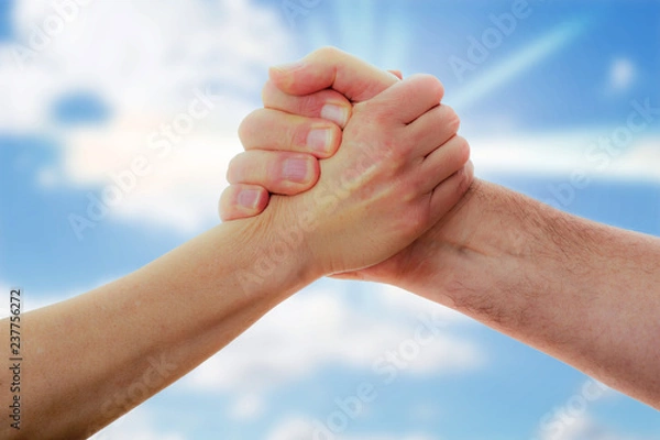 Obraz Two hands are holding tight