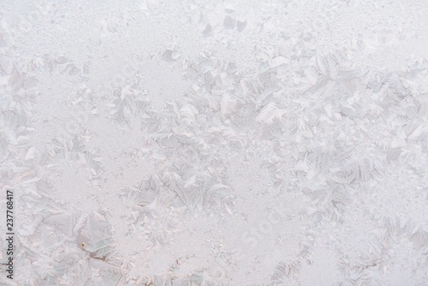 Fototapeta Background ice on the glass. Frost. The texture of frost. The glass is frozen.