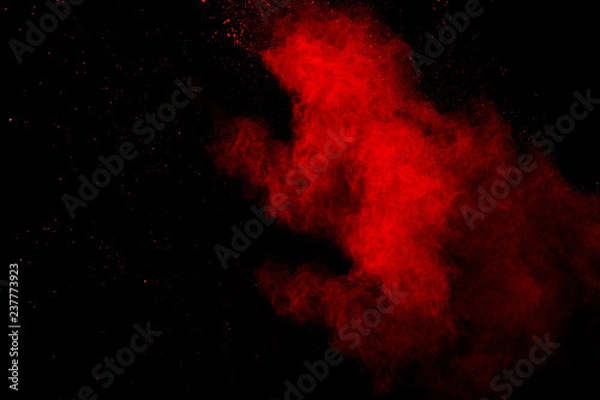 Obraz Abstract Red powder splatted background,Freeze motion of red powder exploding/throwing green dust.