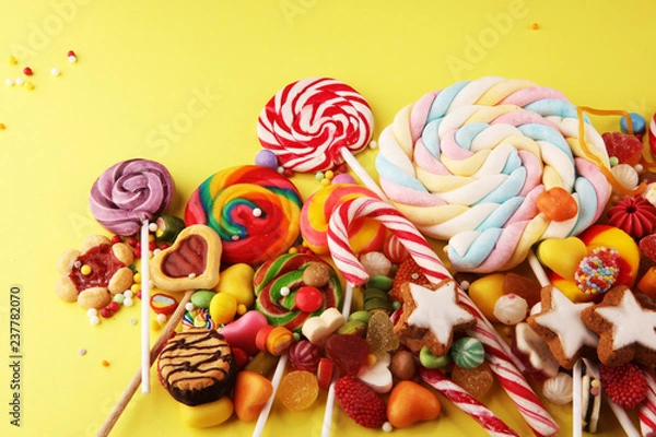Fototapeta candies with jelly and sugar. colorful array of different childs sweets and treats.