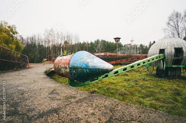 Fototapeta Old rocket ride carousel in abandoned amusement park