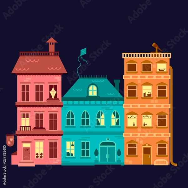 Fototapeta Three colored houses on a dark background with different windows night