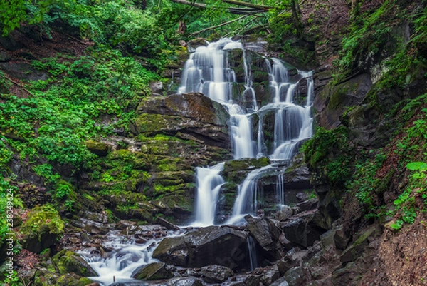 Fototapeta Beautiful high waterfall deep in the Carpathian mountains.