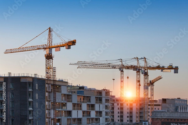 Fototapeta Construction cranes work in thef Helsinki in winter
