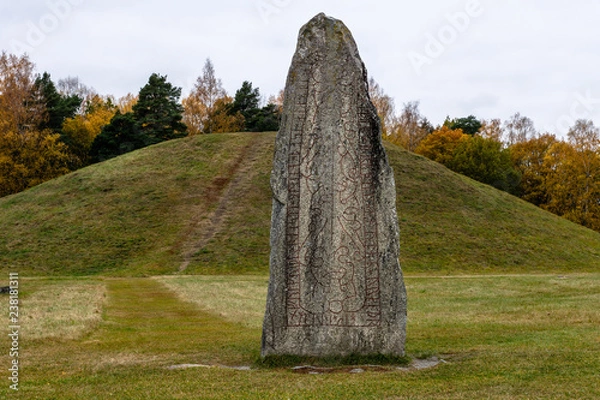 Fototapeta Large rune stone with red runes