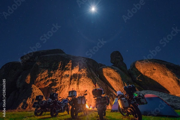 Fototapeta motorcycle camping at a boulder landscape