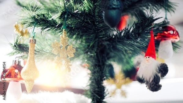 Fototapeta Christmas Ornament With gold Snowflakes, under pine tree, Merry Christmas and Happy New Year