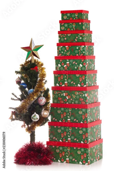 Fototapeta Christmas tree with globes and stack of presents