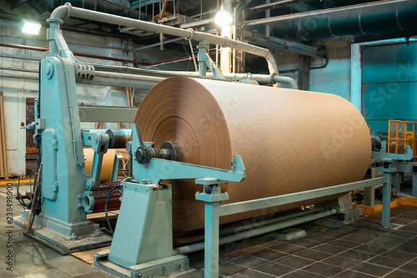 Fototapeta Paper production producing packaging paper and cardboard from waste paper. Industrial equipment, paper machine