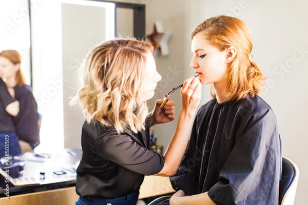 Fototapeta Preparing the model for the shooting, make up and styling