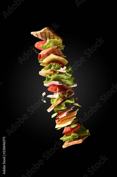 Obraz Flying sandwich on dark background