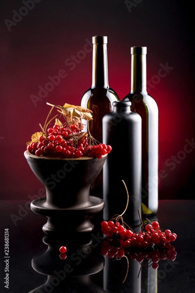 Fototapeta Still life with berries of viburnum red and bottles
