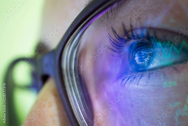Fototapeta businesswoman in glasses, the reflection in the glasses graphs, tables, sale