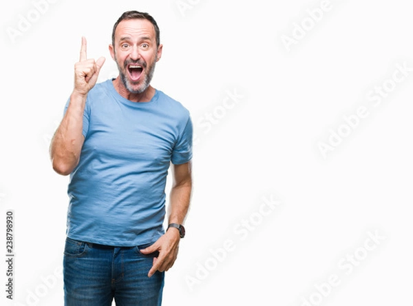 Fototapeta Middle age hoary senior man over isolated background pointing finger up with successful idea. Exited and happy. Number one.