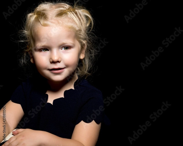 Obraz Little girl on a black background