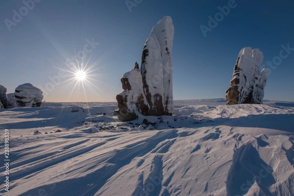 Fototapeta Ostantsy - an isolated array of rock, remaining after the destruction of the unstable part: the formation, weathering, rock remnants. Yakutia. Russia