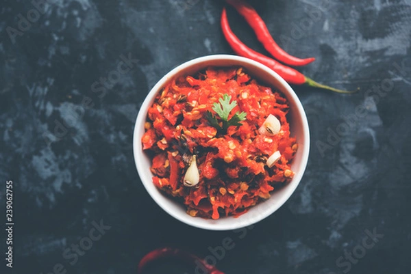 Fototapeta Hot and spicy Hot chilli chutney using lal mirch, cumin seeds, lemon juice and coriander. served in a bowl. selective focus
