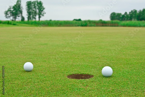 Obraz Two golf balls near the hole