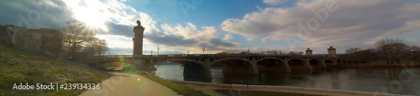 Fototapeta Sun Rays Over Market Street Bridge In River Commons Wilkes-Barre