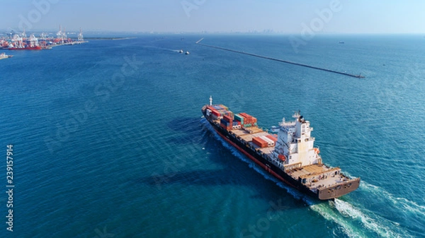 Obraz Aerial view container ship going to sea port for import export, shipping or transportation concept background.