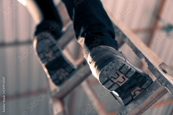 Obraz Engineering engineers are climbing stairs in the construction site.