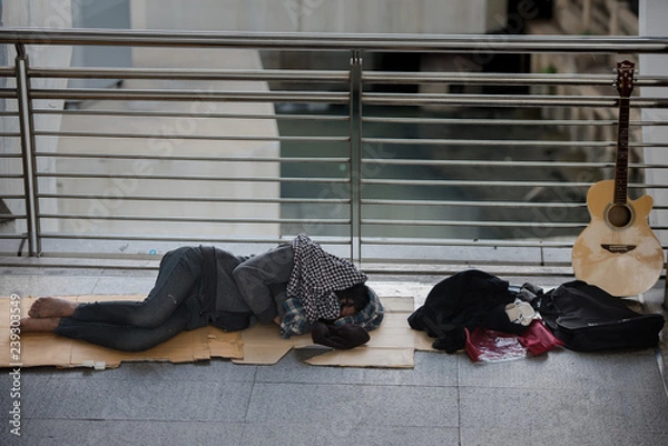 Fototapeta Homeless man sleep on the BTS station
