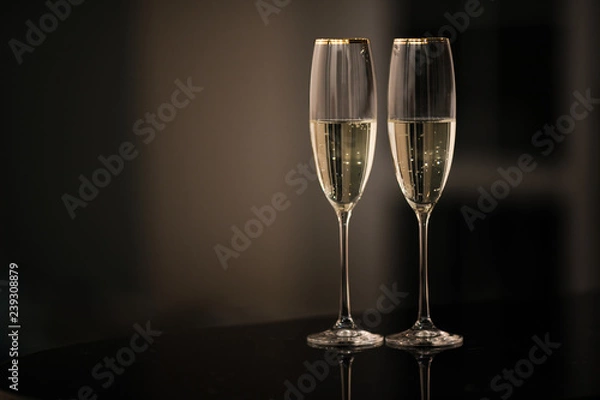 Obraz A pair of glasses of champagne in the interior. New Year and others holiday concept.