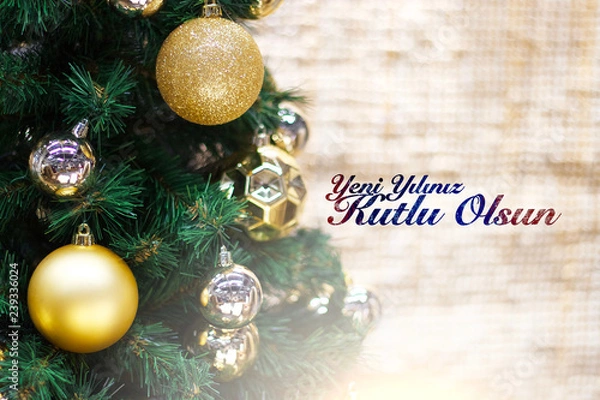 Fototapeta Shiny gold and silver christmas balls on white with pine tree. Yeni yılınız kutlu olsun means happy new year