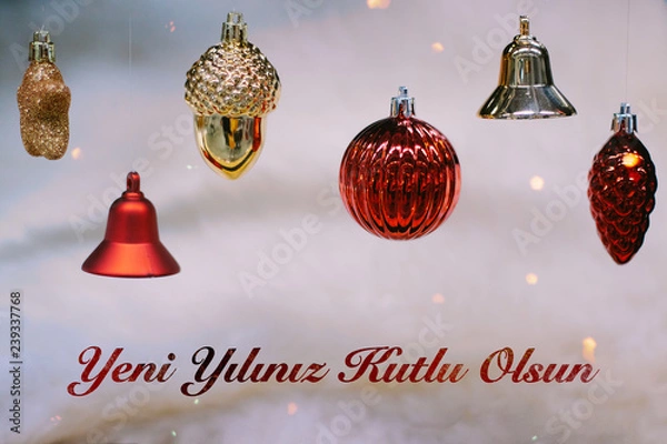 Fototapeta Shiny gold and red christmas balls and bells for new year. Yeni yılınız kutlu olsun means happy new year