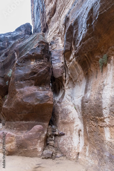 Fototapeta Al-Siq - canyon leading  through red-rock walls to Petra - the capital of the Nabatean kingdom in Wadi Musa city in Jordan