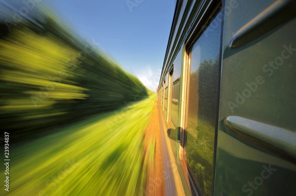 Fototapeta Fast riding a train with motion blur