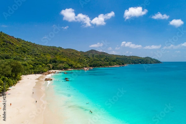 Fototapeta Aerial view of sandy beach with tourists swimming in beautiful clear sea water