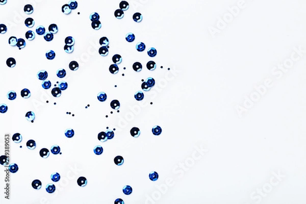 Obraz Round blue sequins on white background